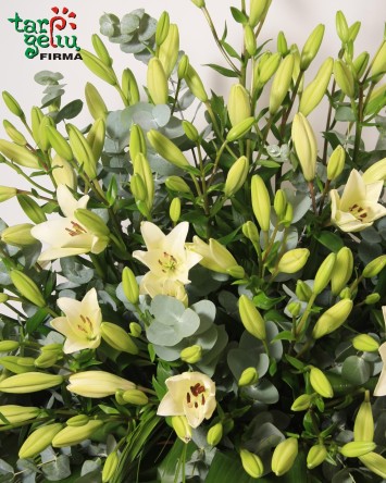 Funeral arrangement with lilies